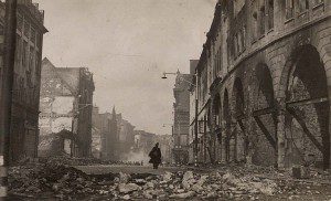 A policeman walks along ruined Castle Street
